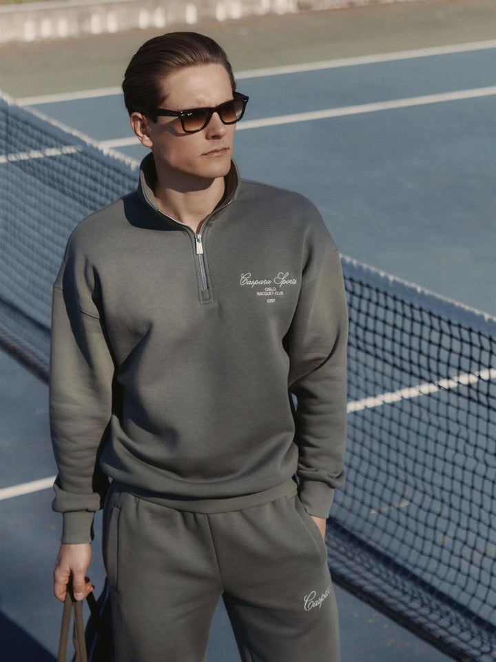 M. Raquet club half-zip